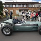 Barrie Williams at the wheel of  an Aston Martin DBR4 Formula One racing car at the September 2015 celebration event in Farsley