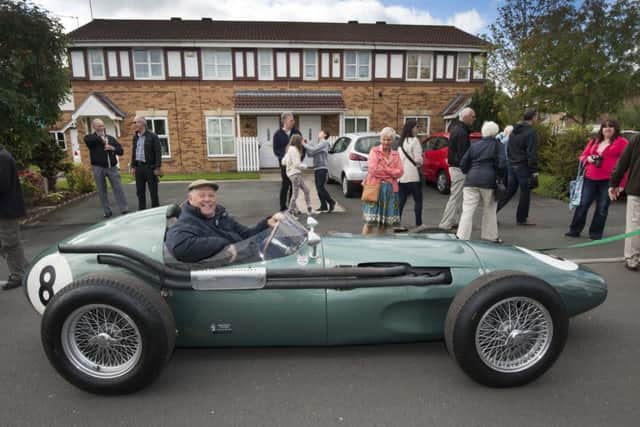 Barrie Williams at the wheel of an Aston Martin DBR4 Formula One racing car at the September 2015 celebration event in Farsley