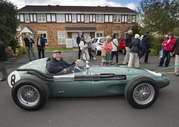Barrie Williams at the wheel of  an Aston Martin DBR4 Formula One racing car at the September 2015 celebration event in Farsley