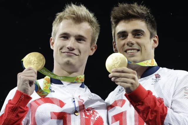 City of Leeds divers Jack Laugher (left) and Chris Mears pose with their gold medals after the men's synchronized 3-meter springboard diving final.
