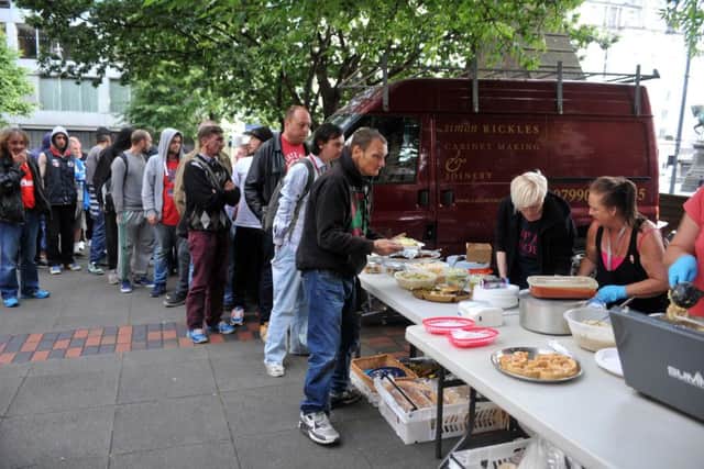 Dozens of people come to the street kitchen at Mill Hill Chapel every Wednesday evening.
