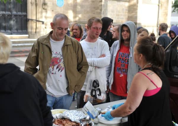 Homeless Leeds Support Group volunteers man its weekly street kitchen in Leeds city centre. Pictures by Tony Johnson.
