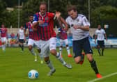 Guiseley's Jordan Preston, right, takes on Dagenham and Redbridge's Scott Doe. PIC: James Hedley.