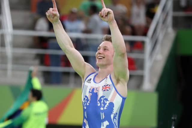 Nile Wilson celebrates bronze. PIC: PA