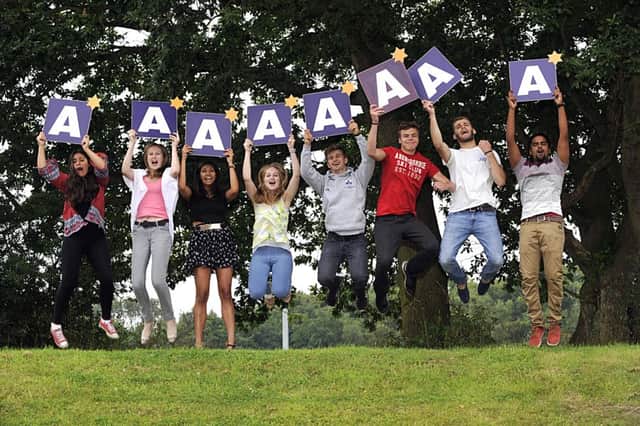 Students at The Grammar School at Leeds celebrate gaining A in the A level results