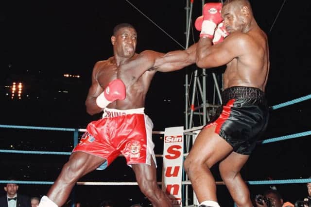 Frank Bruno fighting Oliver McCall on his way to winning the WBC heavyweight title at Wembley in 1995.