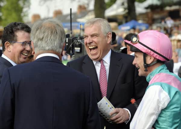 Prince Andrew shares a joke with jockey Pat Smullen during the first day of the Ebor Festival. Pictures by Simon Hulme.