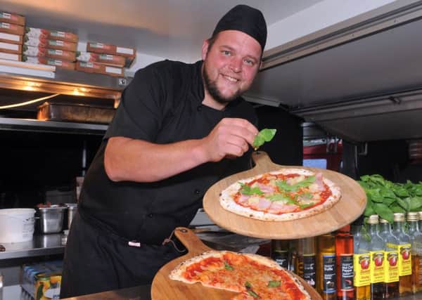 Scott Gibbon of Big Red Oven shows off his pizzas. PIC: Tony Johnson