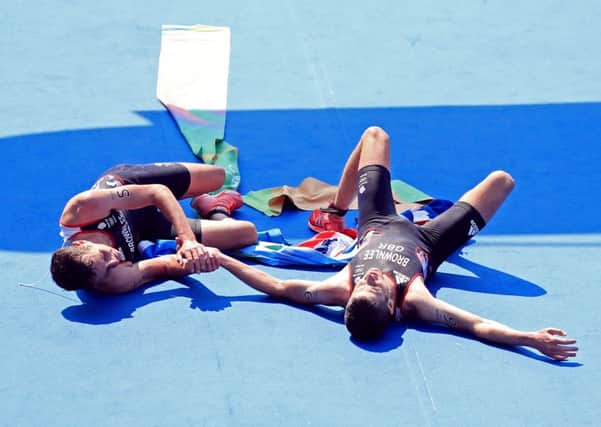 OH BROTHER: Leeds's Alistair Brownlee (left) and brother Jonny embrace after winning Gold and Silver in the Men's Triathlon. Picture: Mike Egerton/PA.