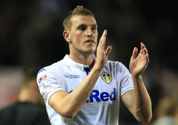Chris Wood applauds the United fans.