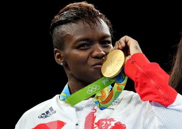 Great Britain's Nicola Adams with her gold medal following victory over France's Sarah Ourahmoune in the women's flyweight final at the Riocentro 6 on the fifteenth day of the Rio Olympics Games, Brazil. PRESS ASSOCIATION Photo. Picture date: Saturday August 20, 2016. Photo credit should read: Owen Humphreys/PA Wire. EDITORIAL USE ONLY