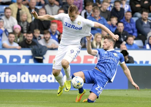 Chris Wood is hauled back by Sam Hutchinson.
 PIC: Bruce Rollinson