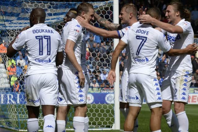 Chris Wood celebrates his goal with Liam Cooper.