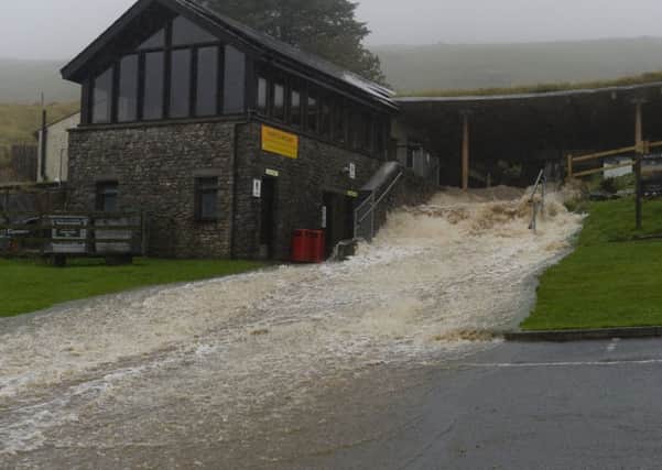 Flood water spews out of the entrance of White Scar Caves, Ingleton,  following heavy overnight rain. Picture: Bruce Rollinson