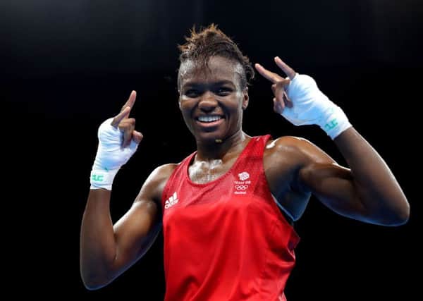 Nicola Adams celebrates victory over France's Sarah Ourahmoune to win gold following the women's flyweight final. Picture: Owen Humphreys/PA Wire