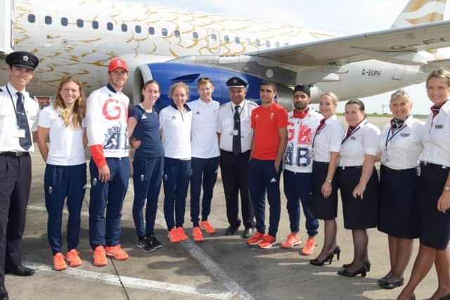 LANDING PARTY: From left, Vicky Holland, Gordon Benson, Laura Weightman, Non Stanford, Tom Bosworth, Muhammed Ali and Qais Ashfaq with the British Airways crew at Leeds Bradford Airport.