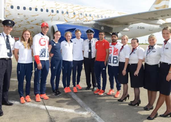 LANDING PARTY: From left, Vicky Holland, Gordon Benson, Laura Weightman, Non Stanford, Tom Bosworth, Muhammed Ali and Qais Ashfaq with the British Airways crew at Leeds Bradford Airport.