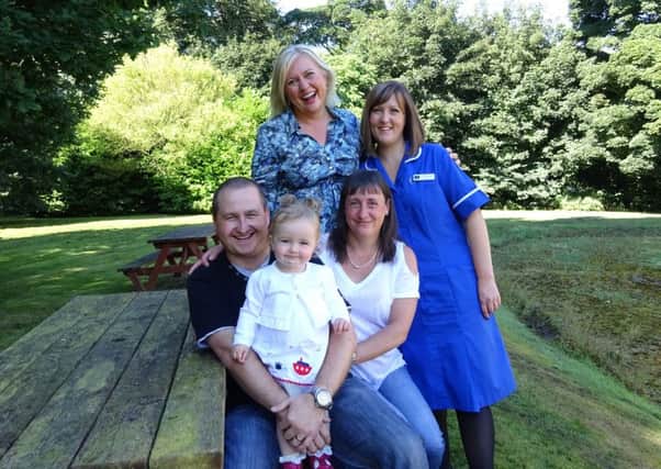 Dr Virginia Beckett, fertility nurse Susan Riddiough with Martin and Lisa Dyche and their daughter Phoebe