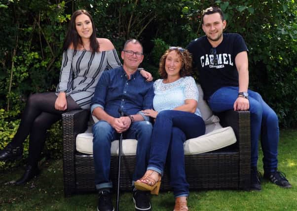 FAMILY: Tim Thomson pictured at home in Pudsey with his wife Karen and children Phoebe and Jordan.