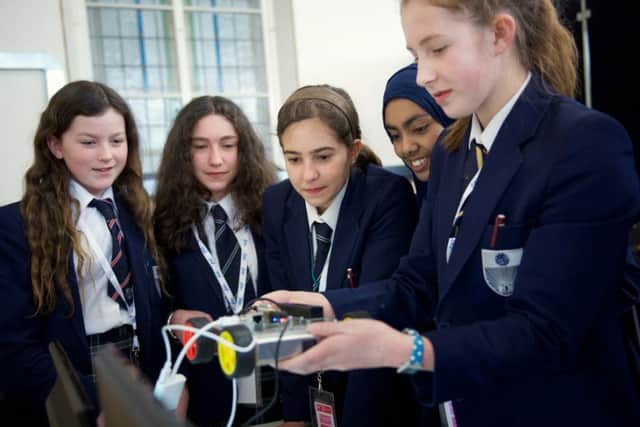 Leeds secondary school students engaging in activities for first Achieve-IT event.