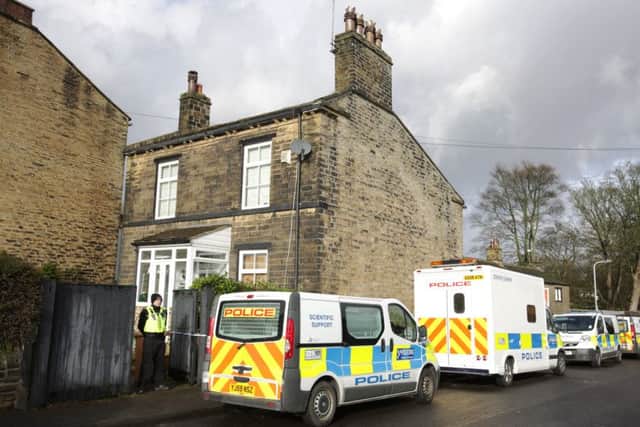 Police attend the murder scene in Idle, Bradford. Pic: Ross Parry