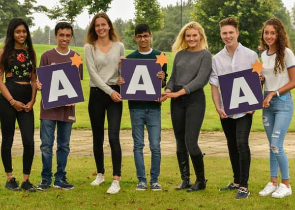 Pupils at The Grammar School at Leeds celebrate their GCSE results. From left: Snighda Mahajan, Nicky Scott, Lucy Burgin, Harin Wijayathunga, Anna Buckley, Harry Gearty and Betsy Perry.