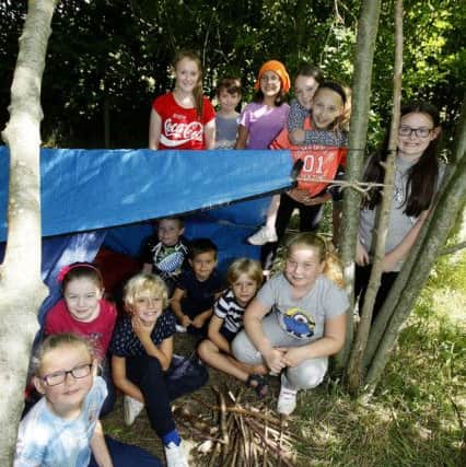 HOLIDAY FUN: Children take part in the den building session at Summerhill in Hartelpool Picture: DAVID WOOD