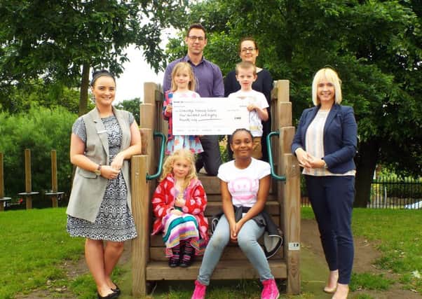 The presentation of a cheque at Cookridge Primary School.