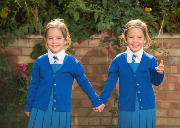Twins Rosie (left) and Ruby Formosa who were born joined at the abdomen and shared part of the intestine, are due to start school in September. Picture: Dominic Lipinski/PA Wire