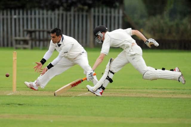 Muhammed Shahnawaz, of Batley, is ready to pounce but Joseph Plater, of Hunslet Nelson,  makes his ground. PIC: Steve Riding