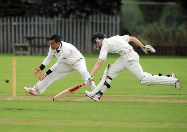 Muhammed Shahnawaz, of Batley, is ready to pounce but Joseph Plater, of Hunslet Nelson,  makes his ground. PIC: Steve Riding