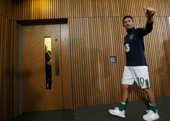 Robbie Keane gives the thumbs up during a press conference after the international friendly against Oman. PIC: PA
