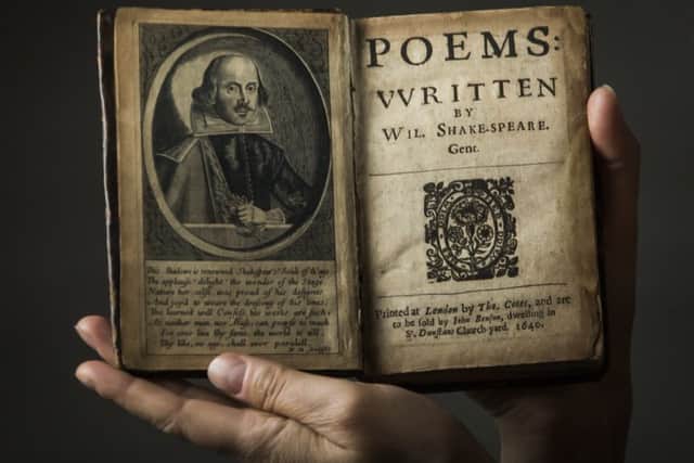Leeds University's Rhiannon Lawrence-Francis holds a book of poems written by William Shakespeare.