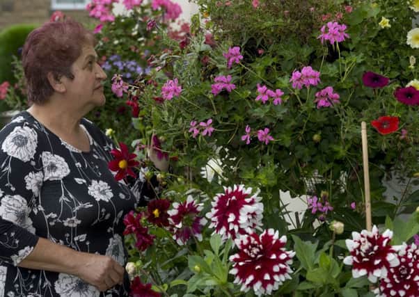 Date: 5th September 2016. Picture James Hardisty.
Galatea Gunning, of Farm Mount, Crossgates, Leeds, in her garden, where she can spend up to eight hours a day looking after her plants for local residents to admire.