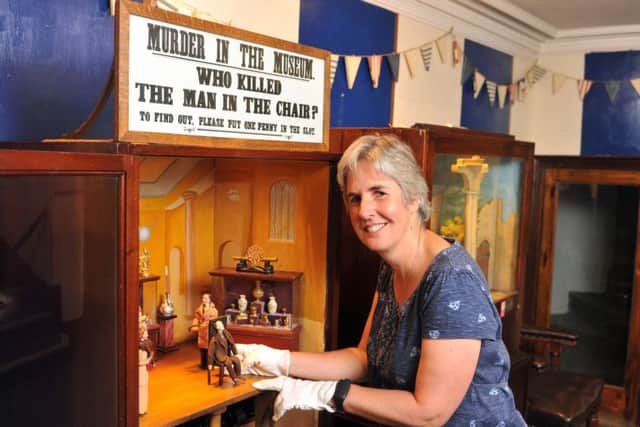 Kitty Ross, curator of history at Leeds Museums with the mechanised murder mystery machine at the Abbey House Museum. PIC: Tony Johnson