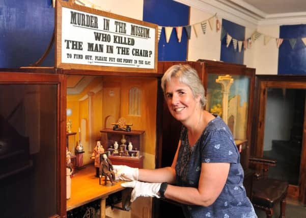 Kitty Ross, curator of history at Leeds Museums with the mechanised murder mystery machine at the Abbey House Museum. PIC: Tony Johnson