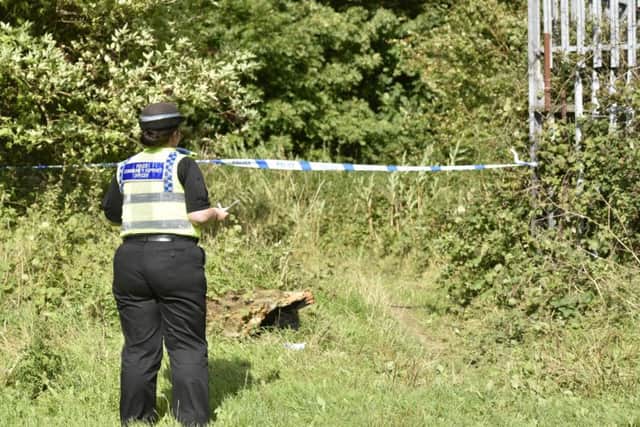 Police have sealed off the woodland near Limewood Approach in Seacroft.