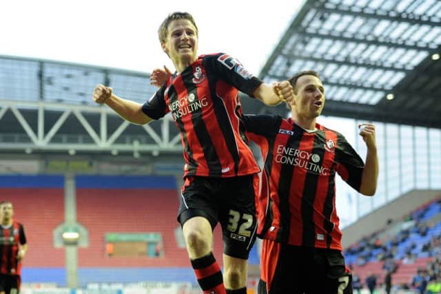 Eunan O'Kane left celebrates  a goal for Bournemouth against Wigan in January 2013. Picture: PA.