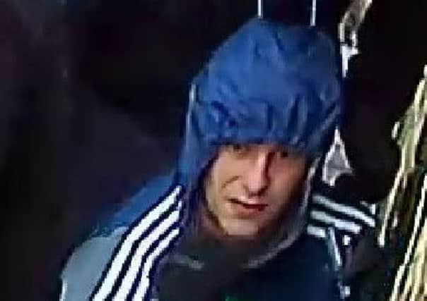An enhanced CCTV image of one of the men police wanted over the burglary in Pudsey.