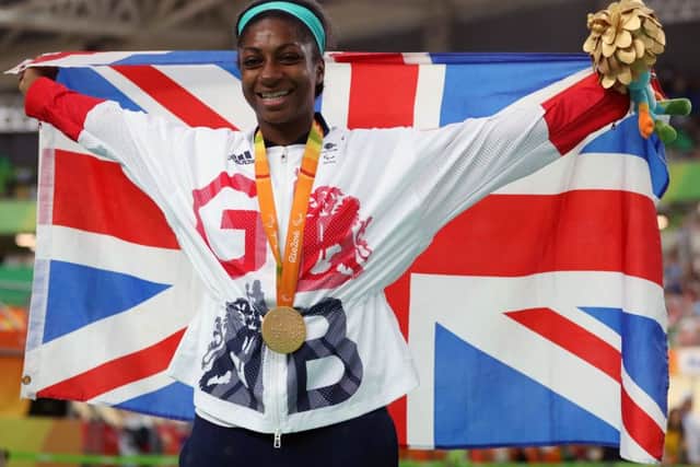 Great Britain's Kadeena Cox celebrates with her gold medal won in the Women's C4-5 500m Time Trial final in Rio. Picture: Andrew Matthews/PA