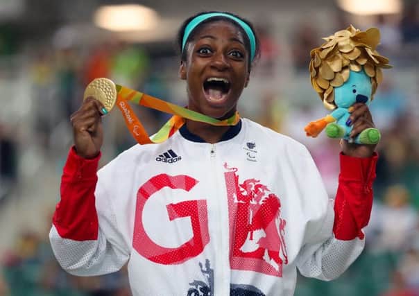 Great Britain's Kadeena Cox celebrates with her Gold medal won in the Women's C4-5 500m Time Trial final at the Olympic Veleodrome during the third day of the 2016 Rio Paralympic Games in Rio de Janeiro, Brazil. Photo credit: Andrew Matthews/PA Wire.