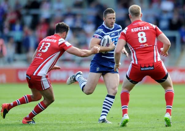 Featherstone's Steve Snitch runs at the Salford defence.
. 
Picture: Jonathan Gawthorpe