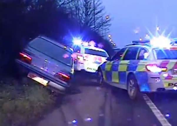 Officers in pursuit of Bruce Dewey, 36, who has been jailed for 15 months after he pleaded guilty to dangerous driving, driving otherwise than in accordance with a licence and driving without third party insurance. Picture: Sussex Police/PA Wire.