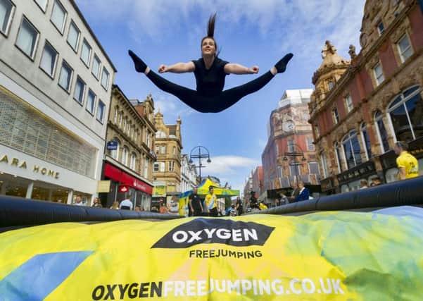 Date:17th September 2016. Picture James Hardisty.A new ultimate trampoline park Oxygen Freejumping opening soon on Cardigan Fields Leisure Park, Kirkstall Road, Leeds. Pictured Staff Saskia Finnerty, aged 19, from Wakefield, showing off her aerobic skills promoting the new facility in Briggate, Leeds.
