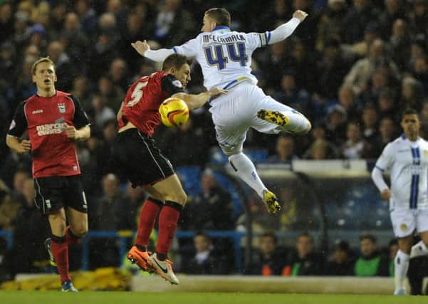 Tommy Smith and Ross McCormack rise for a high ball. Leeds Utd v Ipswich Town during the Championship fixture at Elland Road in 2014. Picture Bruce Rollinson