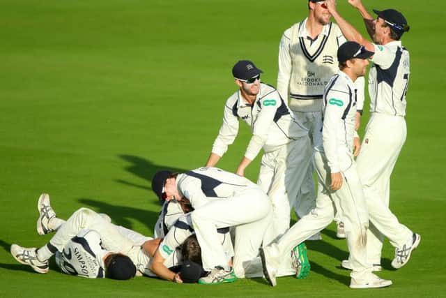 Middlesex's Toby Roland-Jones celebrates with his team-mates after taking a hat-trick of wickets to win the County Championship. Picture by Alex Whitehead/SWpix.com