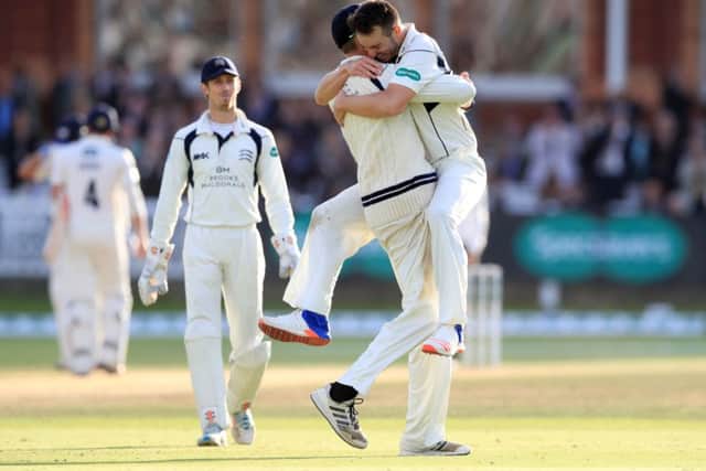 Middlesex's Toby Roland-Jones celebrates after taking the wicket of Yorkshire's Andy Hodd.