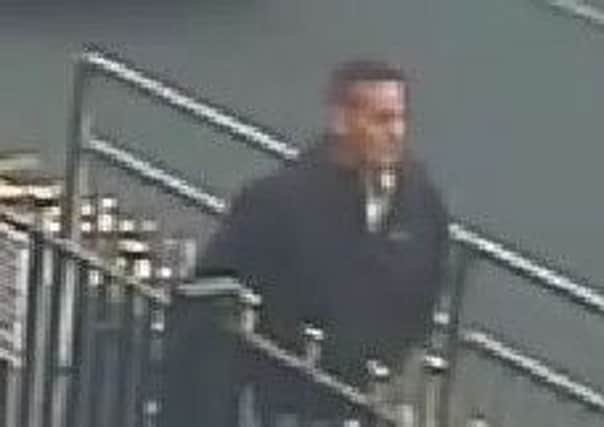 Police want to trace this man after an elderly woman's handbag was stolen from her Rothwell home.