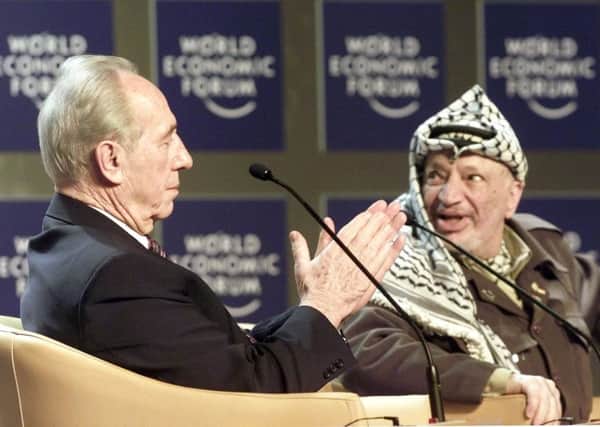 PEACE PRIZE: Shimon Peres with the late Palestinian leader Yasser Arafat.