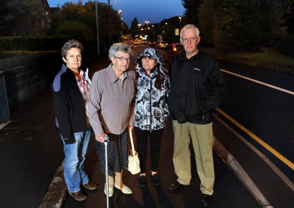 Residents on Stanningley Road in Armley say they have been sworn at by cyclists travelling in the wrong direction after pointing out the cycle lane is a one way system on a stretch of the new Â£29m cycle superhighway in Armley . From left, Elaine Carston, Doreen Armitage, Sally Brennan and Phillip Pantry.
29th September 2016.
Picture : Jonathan Gawthorpe